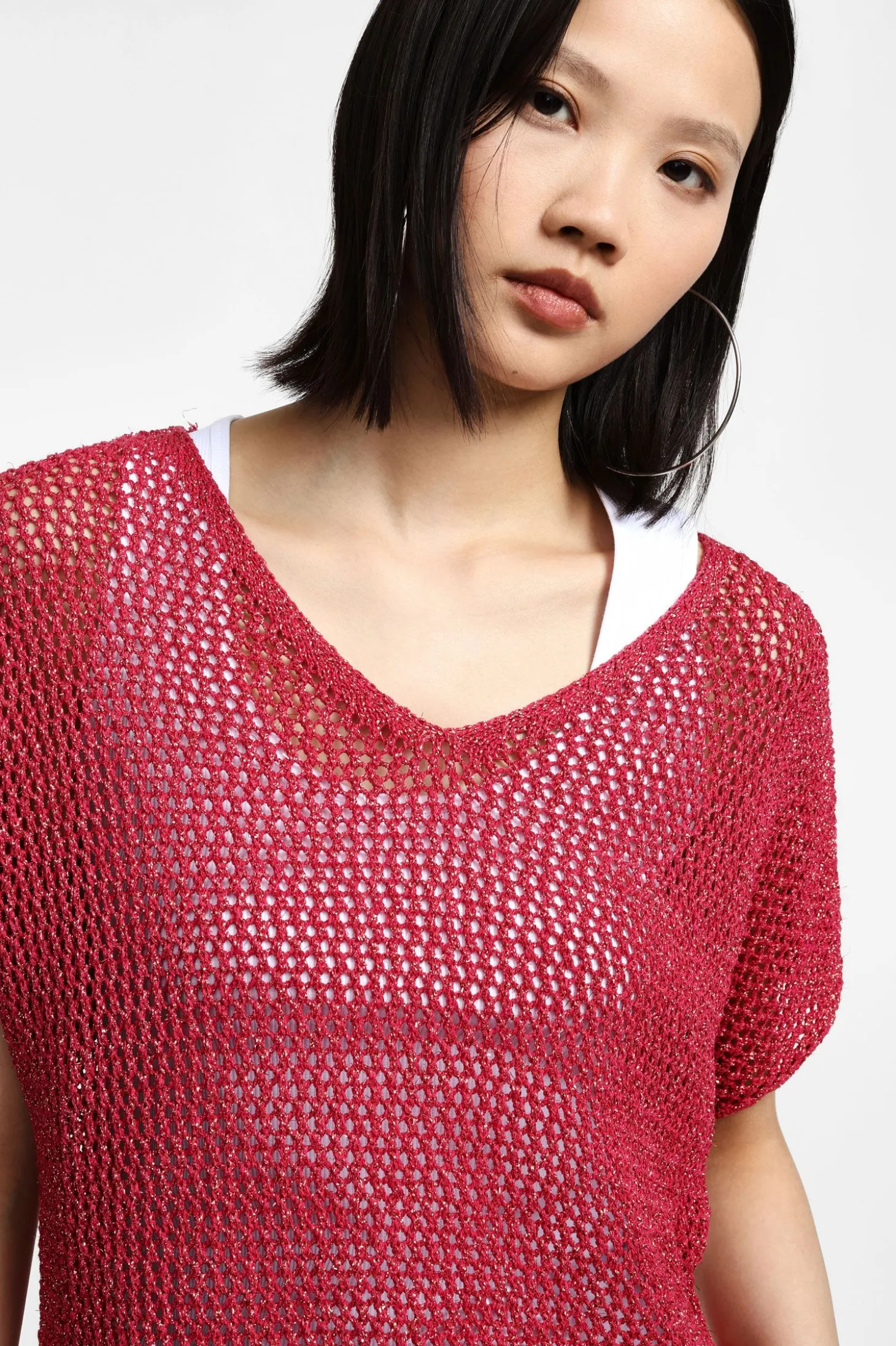 Maglione corto traforato con maniche corte