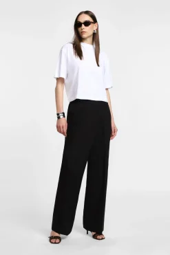 Pantaloni ampi vita alta con chiusura asimmetrica