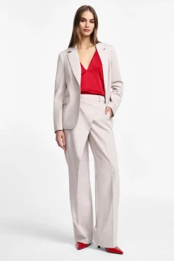 Pantaloni ampi vita alta con chiusura asimmetrica