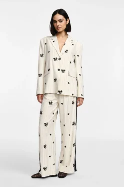 Pantaloni ampia gamba a righe e stampa floreale